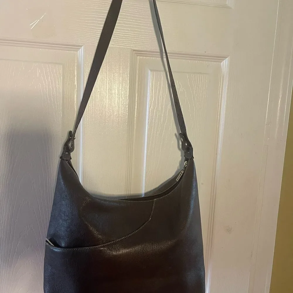 Maxx New York Leather Brown medium shoulder bag with silver tone hardwares.